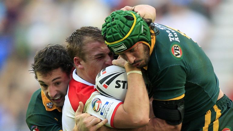 England's Michael Shenton tackled by Australia's Johnathan Thurston and Billy Slater