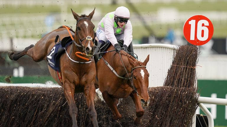 Monkfish clears the last, alongside a loose horse, on his way to winning at the 2021 Cheltenham Festival