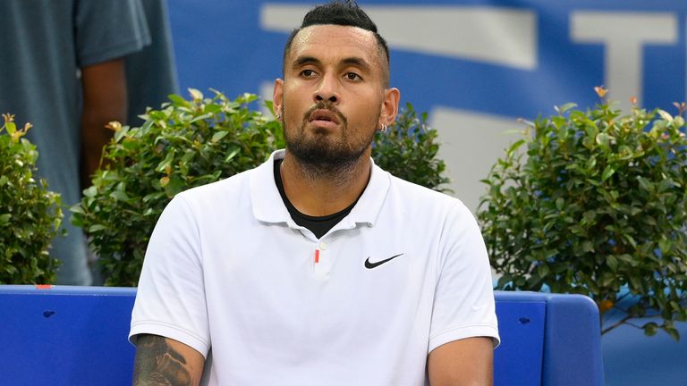 Nick Kyrgios, of Australia, sits during a change over against Mackenzie McDonald during a match in the Citi Open tennis tournament, Tuesday, Aug. 3, 2021, in Washington. McDonald won 6-4, 6-4. (AP Photo/Nick Wass)