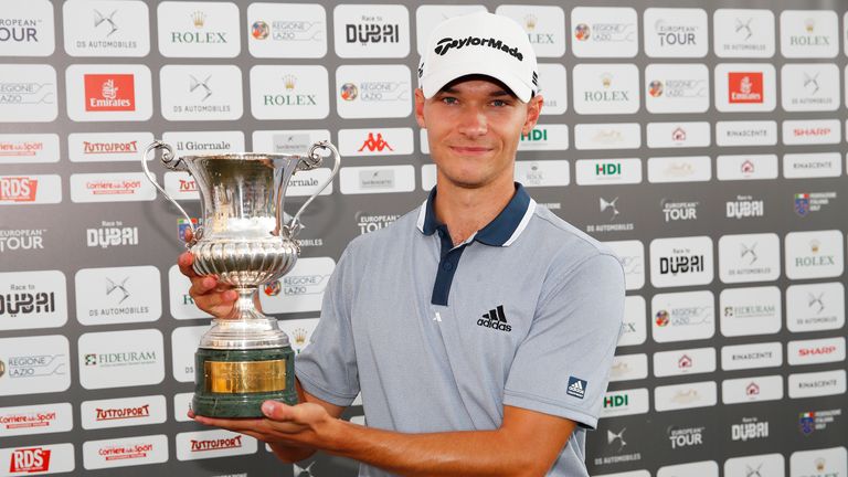 Nicolai Hojgaard of Denmark poses for a photo with the trophy after Day Four of The Italian Open 
