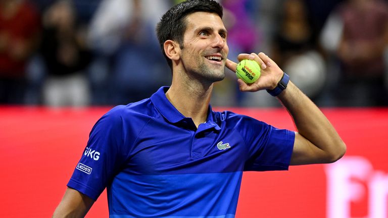Novak Djokovic throws a ball to fans after a Men's Singles match at the 2021 US Open, Thursday, Sep. 2, 2021 in Flushing, NY. (Garrett Ellwood/USTA via AP)