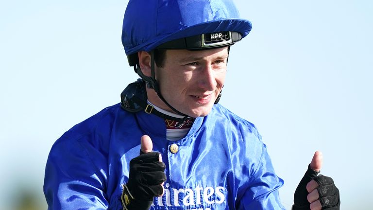 Oisin Murphy gives a thumbs up to the crowd at Newmarket after victory on Benbatl