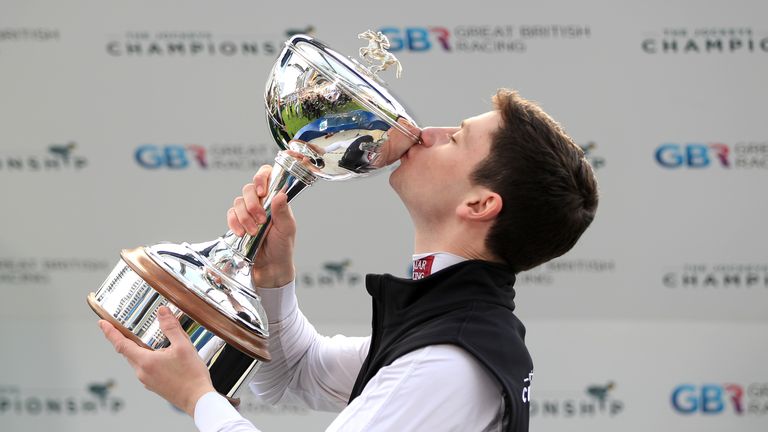 Oisin Murphy celebrates being crowned champion jockey at Ascot