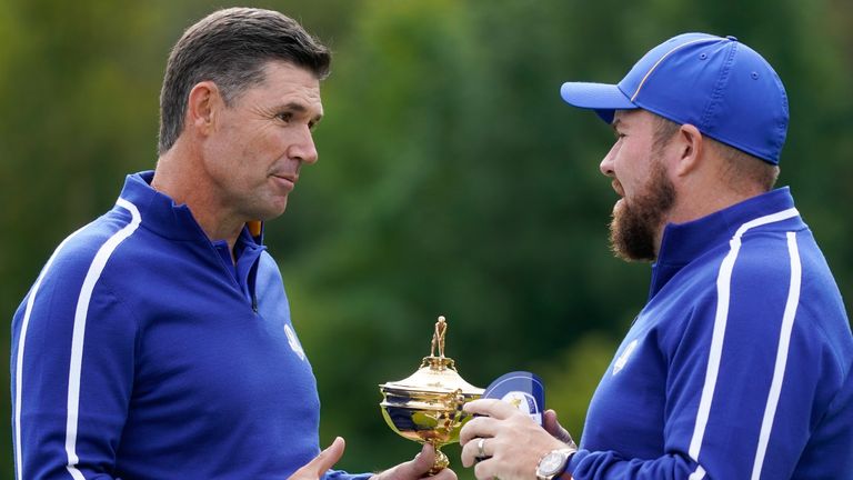 Team Europe captain Padraig Harrington talks to Team Europe's Shane Lowry during a practice day at the Ryder Cup at the Whistling Straits Golf Course Tuesday, Sept. 21, 2021, in Sheboygan, Wis. (AP Photo/Charlie Neibergall)
