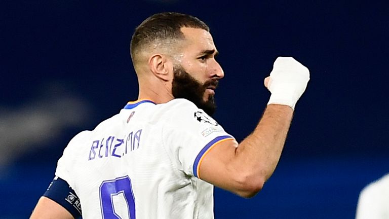 Real Madrid's Karim Benzema, left, celebrates after scoring his side's opening goal from penalty spot during the Champions League group D soccer match between Real Madrid and Sheriff,