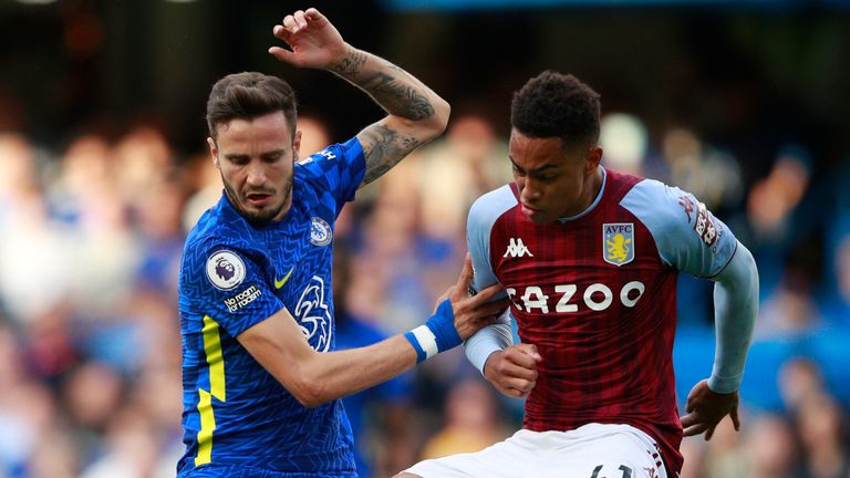 Chelsea's Saul Niguez is tackled by Aston Villa's Jacob Ramsey (AP)