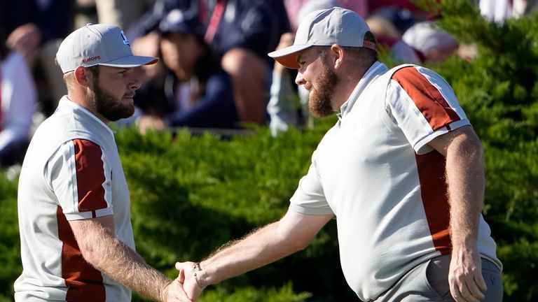 Team Europe's Shane Lowry and Team Europe's Tyrrell Hatton react on the 11th hole during a four-ball match the Ryder Cup at the Whistling Straits Golf Course Saturday, Sept. 25, 2021, in Sheboygan, Wis. (AP Photo/Jeff Roberson)