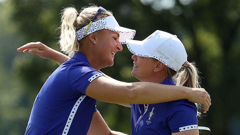 Anna Nordqvist of Team Europe reacts with Matilda Castren of Team Europe after sinking a putt on the 18th green to win the match during the first round of the Solheim Cup