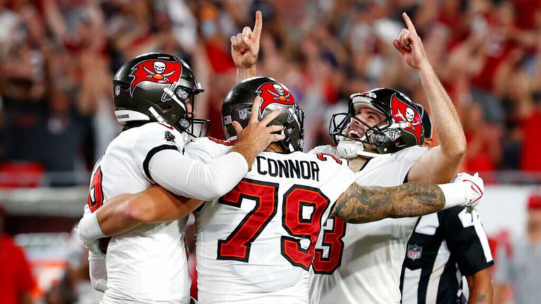 Tampa Bay Buccaneers&#39; Ryan Succop (3) celebrates with Pat O&#39;Connor (79) and Bradley Pinion (8) after kicking what proved to be the game-winning field goal during the second half of an NFL football game against the Dallas Cowboys Thursday, Sept. 9, 2021, in Tampa, Fla. (AP Photo/Scott Audette)