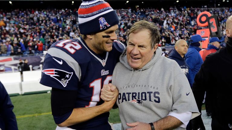 New England Patriots quarterback Tom Brady celebrates with head coach Bill Belichick after defeating the Dolphins 2014