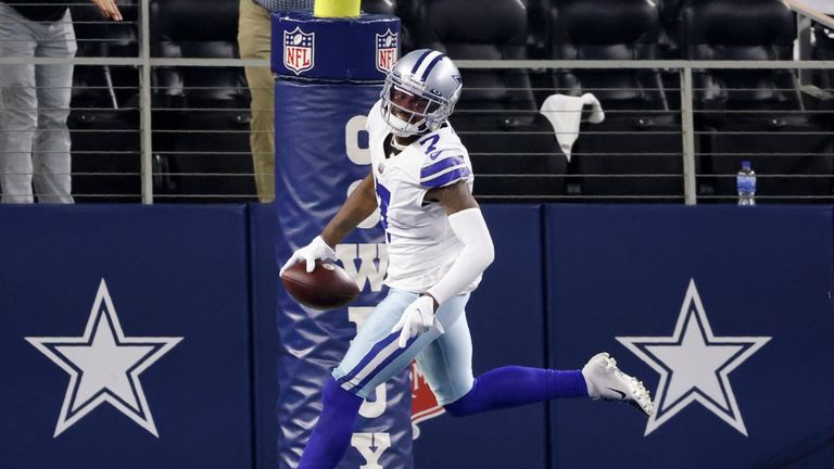 Dallas Cowboys cornerback Trevon Diggs celebrates after intercepting a Philadelphia Eagles&#39; Jalen Hurts pass and returned it for a touchdown