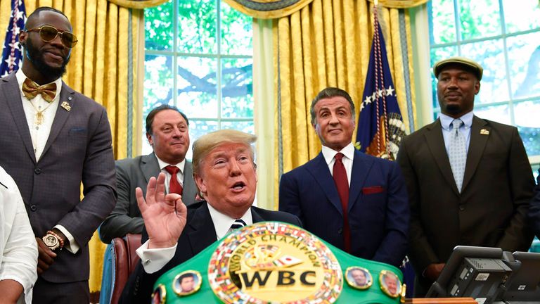 During his presidency Trump pardoned Jack Johnson, the first black heavyweight champion. Pictured with Deontay Wilder, Sylvester Stallone, Lennox Lewis