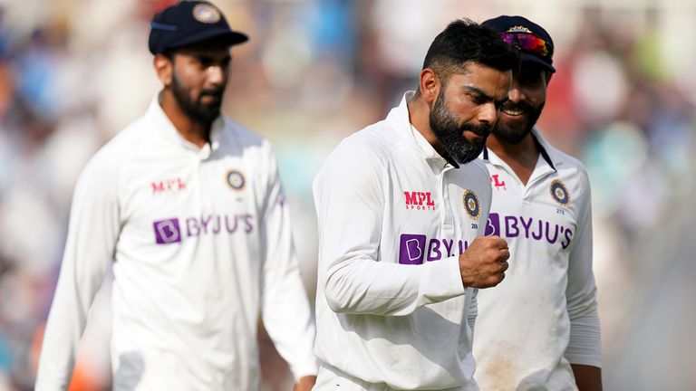 Virat Kohli celebrates the wicket of Chris Woakes on day five of the fourth Test