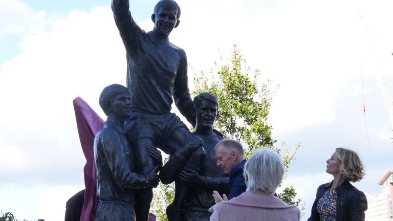Sir Geoff Hurst, with Roberta Moore and Kathy Peters unveil the new statue of the three West Ham legendary World Cup and European Champions Cup winning players Sir Geoff, Bobby Moore and Martin Peters at the London Stadium