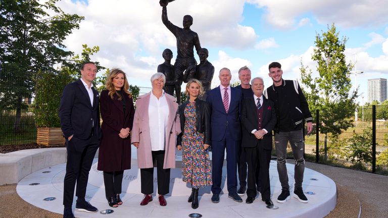 (L to R) West Ham captain Mark Noble, Baroness Brady, Kathy Peters, Roberta Moore, Sir Geoff Hurst, manager David Moyes, West Ham owner David Gold and Declan Rice pose in front of the new statue depicting the three West Ham legendary World Cup and European Champions Cup-winning players Martin Peters, Bobby Moore, Geoff Hurst after its unveiling at the London Stadium