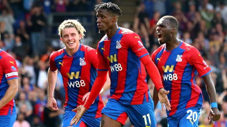 Wilfred Zaha celebrates after scoring form the spot for Palace