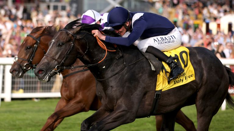 Wings Of War, ridden by Adam Kirby (right), wins The Dubai Duty Free Mill Reef Stakes at Newbury