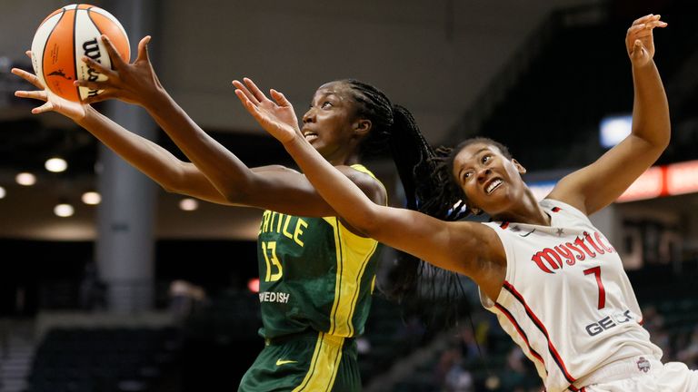  Ezi Magbegor #13 of the Seattle Storm and Ariel Atkins #7 of the Washington Mystics reach for a rebound during the fourth quarter at Angel of the Winds Arena on September 07, 2021 in Everett, Washington.