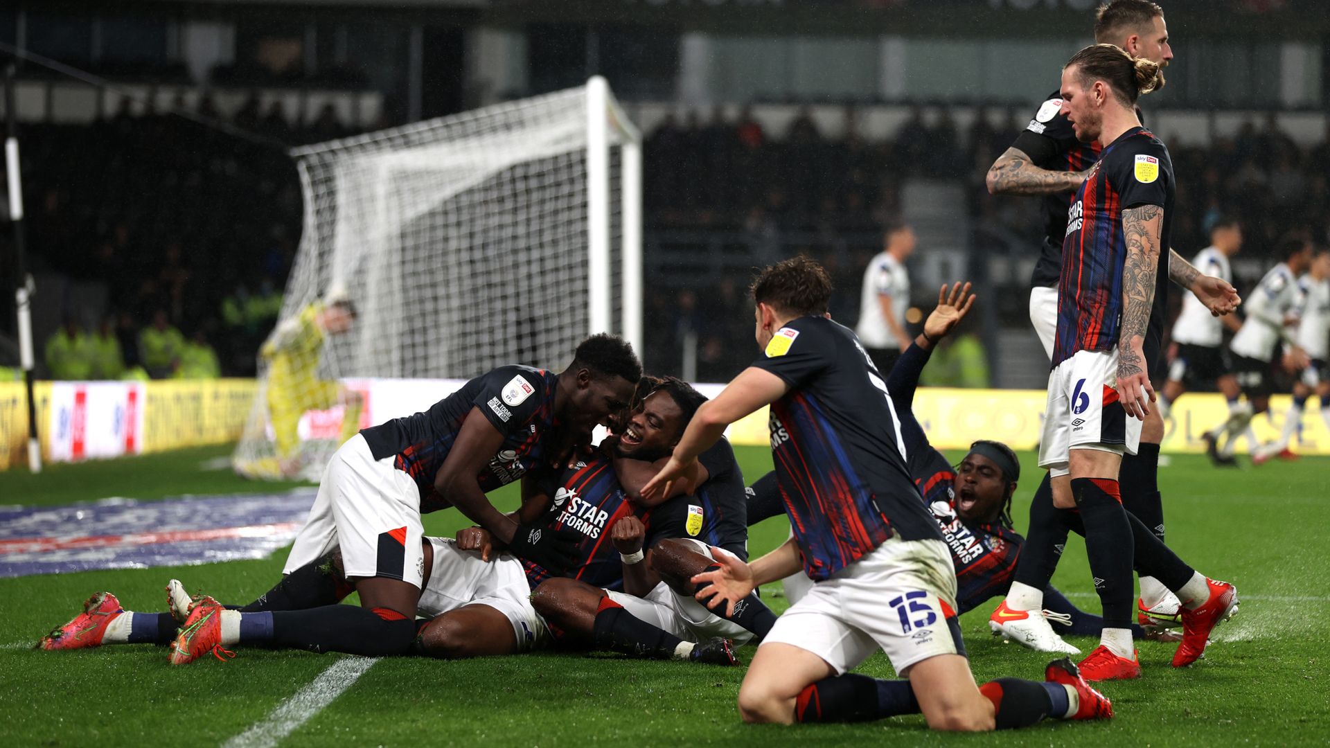 Luton hit back twice to hold Derby