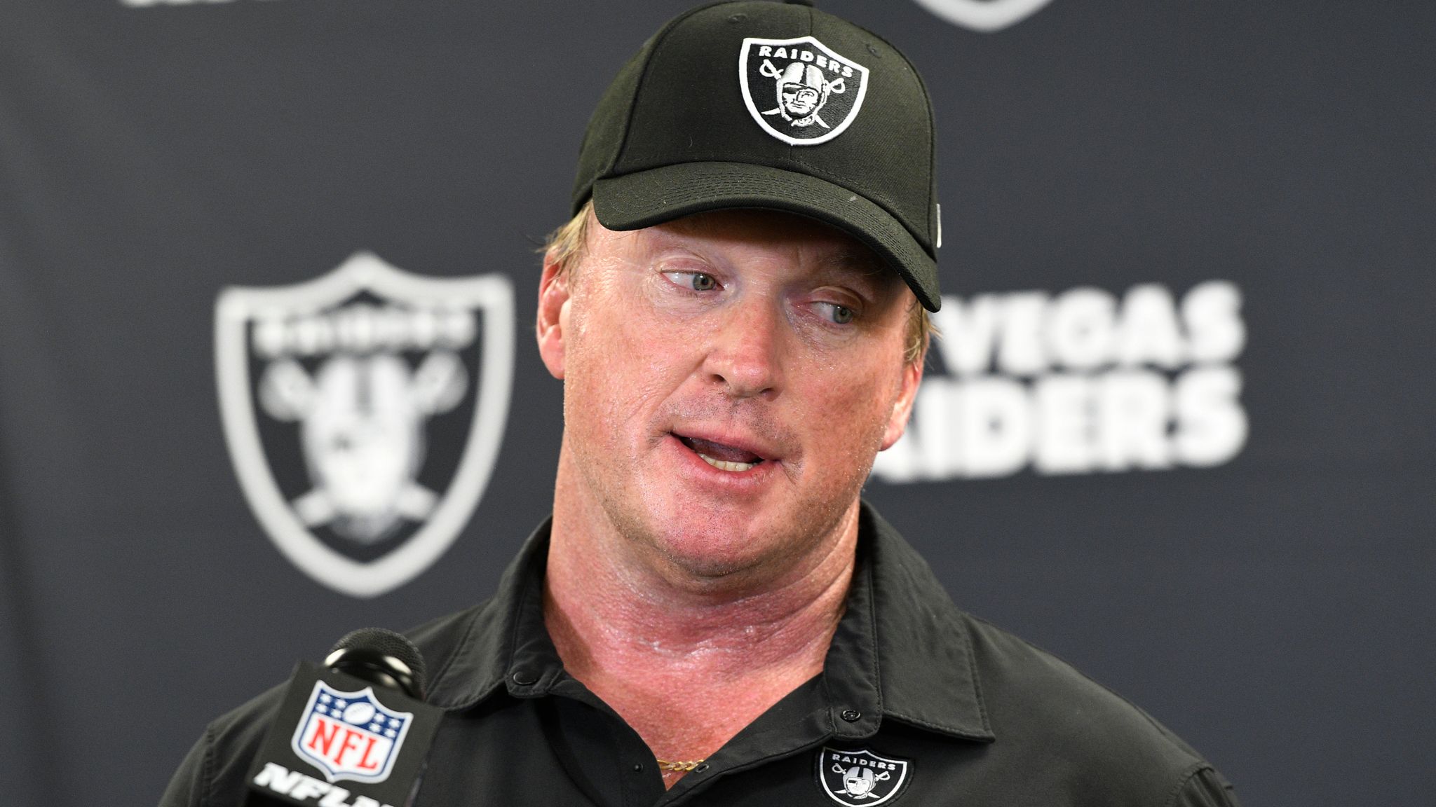 Las Vegas Raiders head coach Jon Gruden greets defensive end Carl