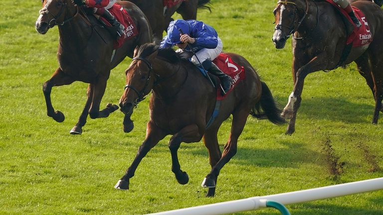 NEWMARKET, ENGLAND - OCTOBER 09: William Buick riding Coroebus (blue) win The Emirates Autumn Stakes at Newmarket Racecourse on October 09, 2021 in Newmarket, England. (Photo by Alan Crowhurst/Getty Images)