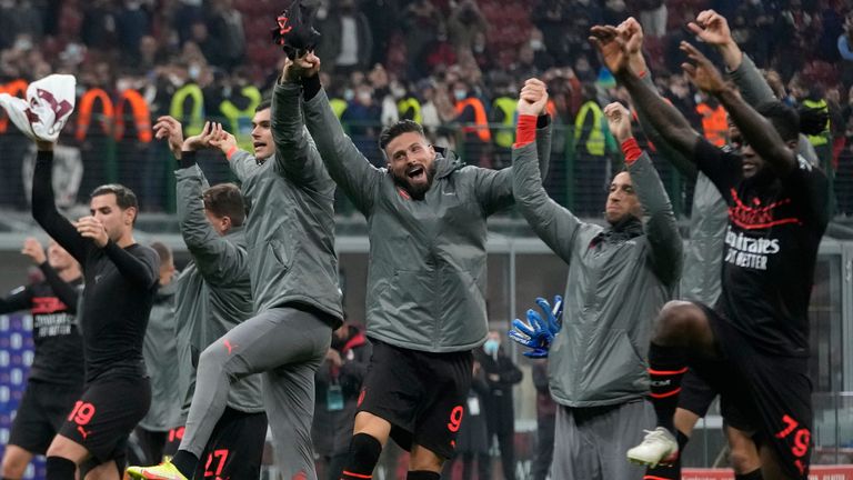 AC Milan celebrate after returning to the top of Serie A after victory over Torino