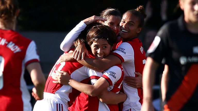 Katie McCabe is mobbed by her team-mates after giving Arsenal the lead against Everton