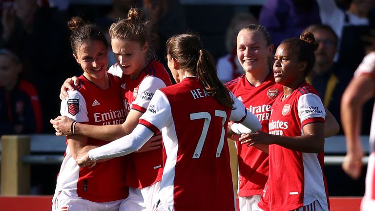 Lotte Wubben-Moy celebrates with her team-mates after putting Arsenal two goals up against Everton