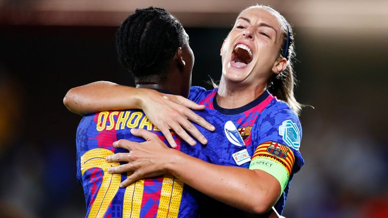 Alexia Putellas celebrates with Asisat Oshoala after scoring Barcelona's second goal against Arsenal