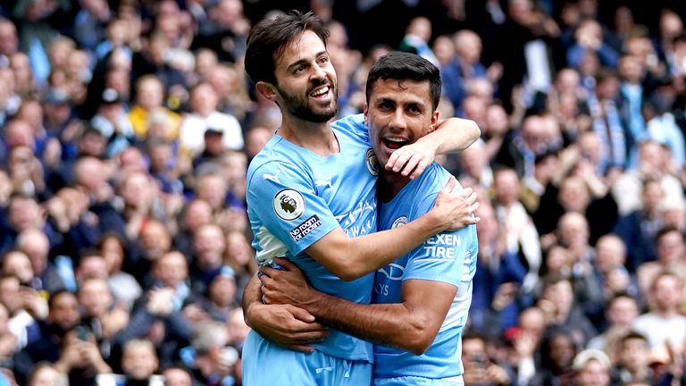 Manchester City&#39;s Bernardo Silva celebrates with Rodri