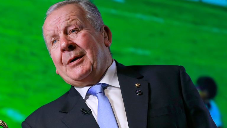 World Rugby Chairman Bill Beaumont speaks with the Webb Ellis Cup during an interview before the match schedule announcement for 2019 Rugby World Cup in Tokyo, Thursday, Nov. 2, 2017. (AP Photo/Shizuo Kambayashi)