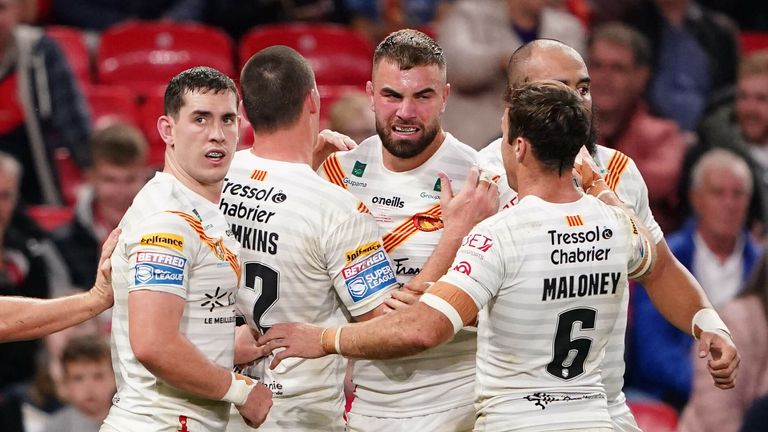 Catalans Dragons' Mike McMeeken (third right) celebrates after scoring a try during the Betfred Super League grand final at Old Trafford, Manchester. Picture date: Saturday October 9, 2021. See PA story RUGBYL Final. Photo credit should read: Zac Goodwin/PA Wire. RESTRICTIONS: Use subject to restrictions. Editorial use only, no commercial use without prior consent from rights holder.