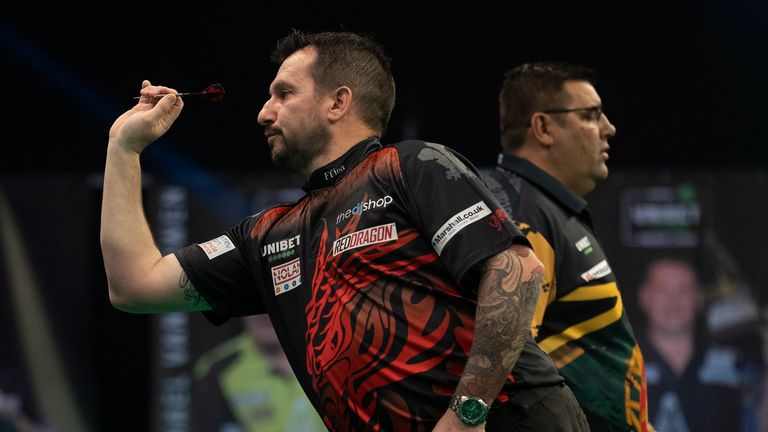 UNIBET PREMIER LEAGUE 2021.NIGHT3.MARSHALL ARENA,.MILTON KEYNES.PIC;LAWRENCE LUSTIG.JONNY CLAYTON V JOSE DE SOUSA.JONNY CLAYTON IN ACTION HITS A 9 DARTER.