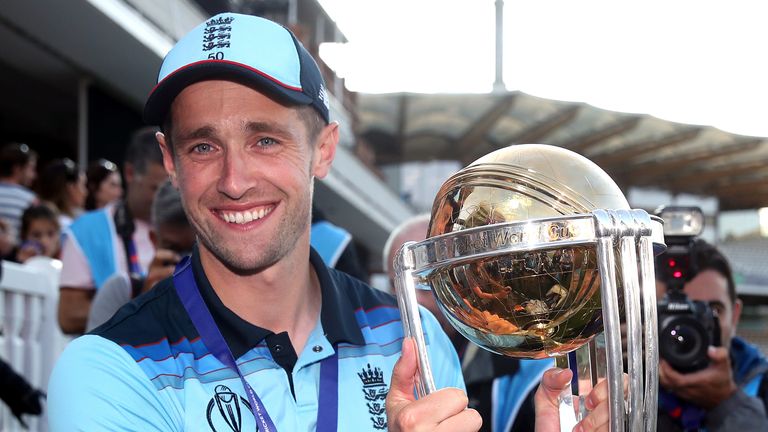 England's Chris Woakes celebrates with the ICC World Cup at Lord's (PA Images)