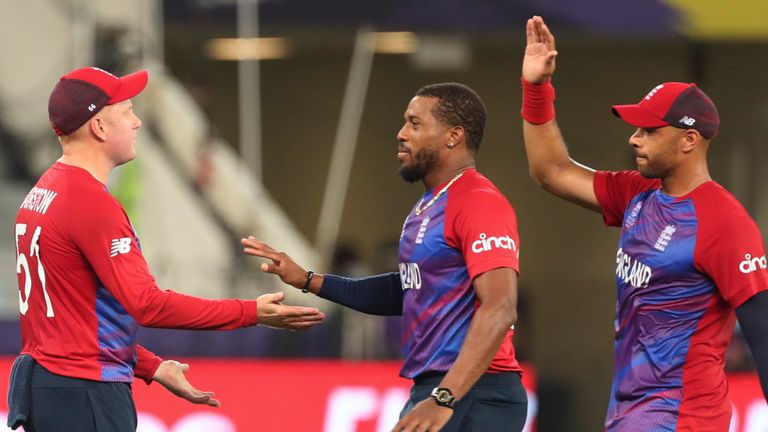England's Chris Jordan (r) celebrates the dismissal of Australia's captain Aaron Finch with Jonny Bairstow at the T20 World Cup (Associated Press)