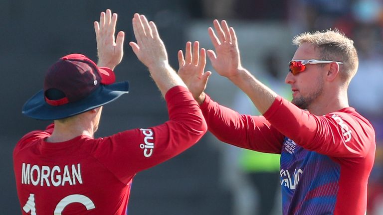 Liam Livingstone (R) celebrates a wicket with England captain Eoin Morgan at the T20 World Cup (Associated Press)