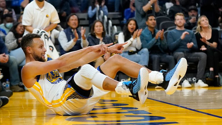 Golden State Warriors guard Stephen Curry celebrates after scoring against the Memphis Grizzlies during the first half of an NBA basketball game in San Francisco, Thursday, Oct. 28, 2021.