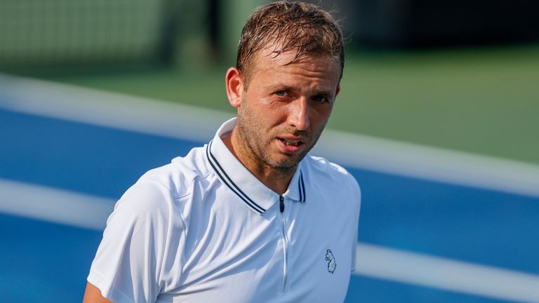 Dan Evans, of Britian, walks across the court during a match against Richard Gasquet in the Round of 16 at the Winston-Salem Open tennis tournament in Winston-Salem, N.C., Wednesday, Aug. 25, 2021. Gasquet won 6-4, 7-6. (AP Photo/Nell Redmond)