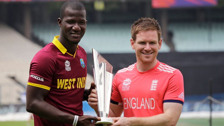 West Indies... captain Darren Sammy, left, and England&#39;s captain Eoin Morgan pose with the winner&#39;s trophy a day ahead of their final match of the ICC World Twenty20 2016 cricket in Kolkata, India, Saturday, April 2, 2016.  (AP Photo/Bikas Das)