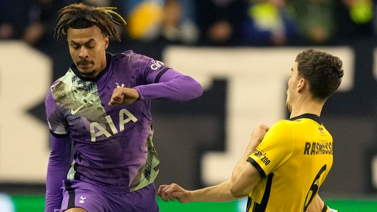 Tottenham's Dele Alli, left, challenges for the ball with Vitesse's Jacob Rasmussen