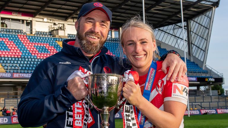 Picture by Allan McKenzie/SWpix.com - 10/10/2021 - Rugby League - Betfred Women's Super League Grand Final - St Helens v Leeds Rhinos - Emerald Headingley Stadium, Leeds, England - St Helens's coach Derek Hardman & captain Jodie Cunningham with the Betfred Women's Super League trophy after victory over Leeds.