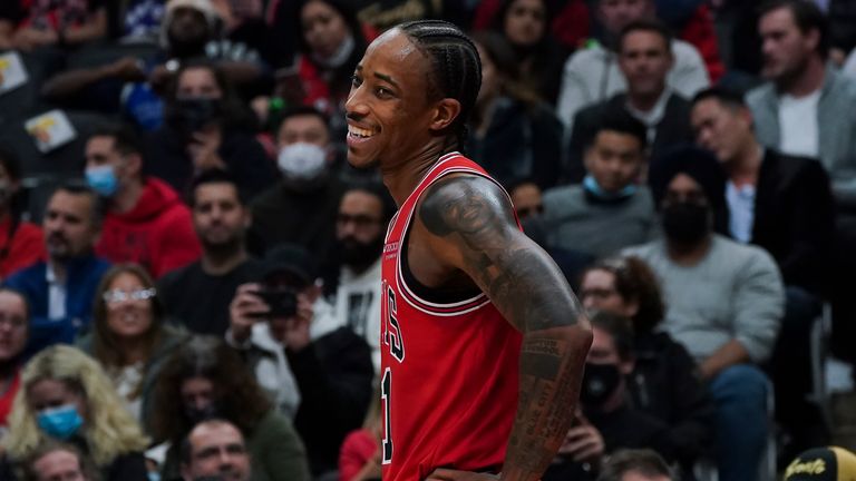 Chicago Bulls forward DeMar DeRozan (11) smiles on the court during first-half NBA basketball game action against the Toronto Raptors in Toronto, Monday, Oct. 25, 2021.