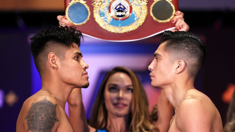 SAN DIEGO, CALIFORNIA - OCTOBER 14: Emanuel Navarrete (L) and Joet Gonzalez (R) face-off during the weigh-in prior to their WBO world featherweight championship fight at Omni San Diego Hotel on October 14, 2021 in San Diego. (Photo by Mikey Williams/Top Rank Inc via Getty Images)
