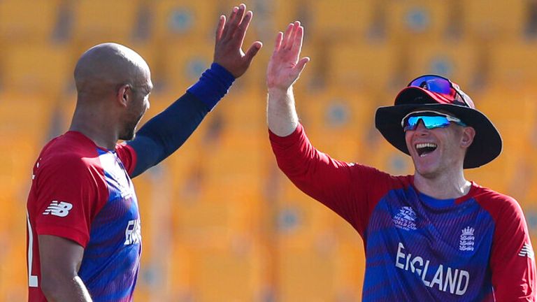 Tymal Mills celebrates one of his three wickets with England captain Eoin Morgan