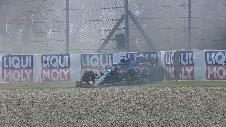 
Fernando Alonso has found the barriers at Turn 19 after losing the back end of his Alpine and spinning off.