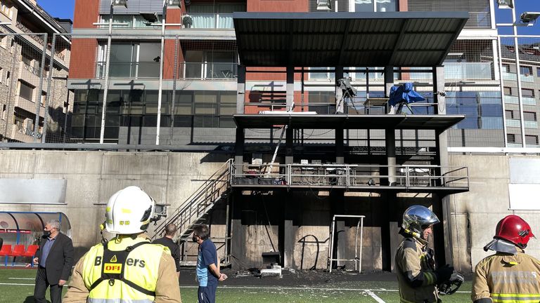 Emergency Services inspect damage at the Andorra National Stadium after a fire broke out in the broadcast gantry