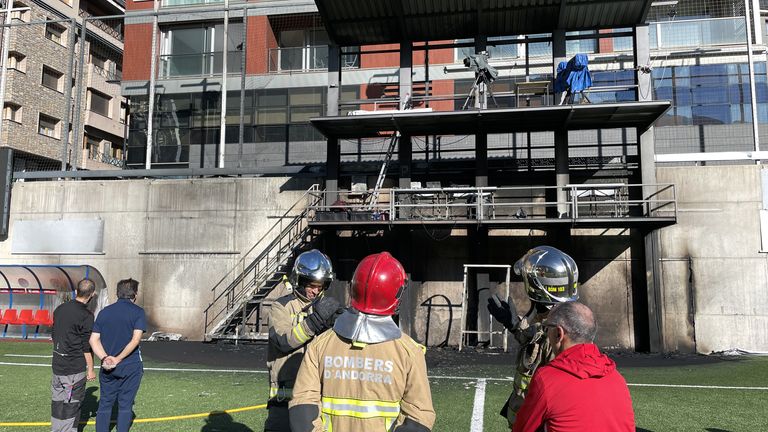Emergency Services inspect damages after a fire broke out at the Andorra National Stadium in the broadcast gantry