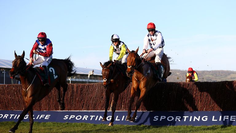 Galvin (red cap, right) en route to victory in the National Hunt Chase at Cheltenham