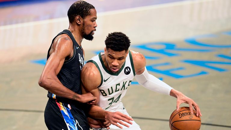Giannis Antetokounmpo of the Milwaukee Bucks is defended by Kevin Durant of the Brooklyn Nets during the Eastern Conference Finals last season