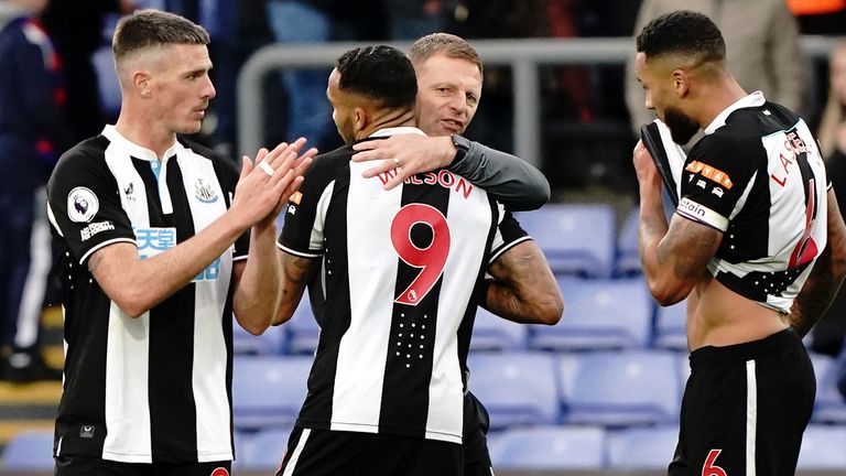 Newcastle United caretaker manager Graeme Jones embraces goalscorer Callum Wilson